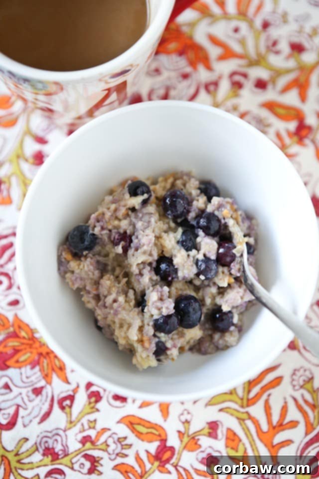 A steaming bowl of Blueberry, Banana, and Peanut Butter Oatmeal, ready to be enjoyed for a healthy and quick breakfast