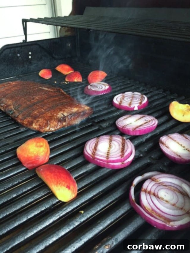 Steak Spinach Salad with Grilled Peaches and Red Onion